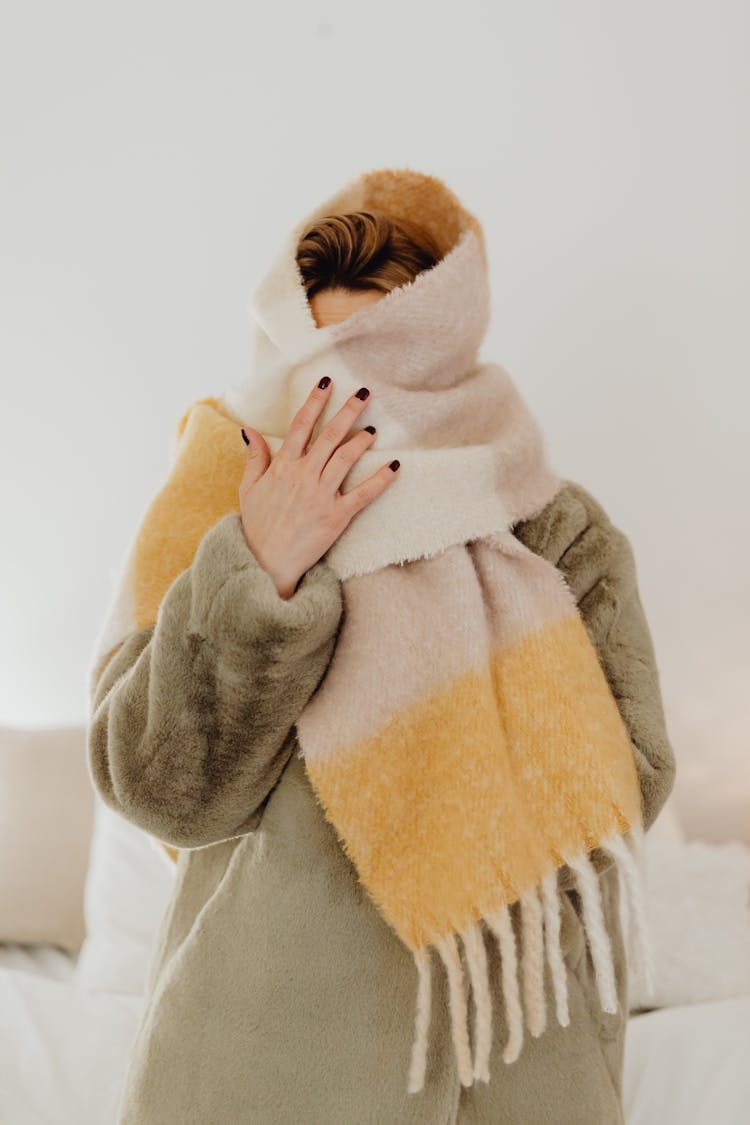 Woman In A Fur Coat Wrapped In A Scarf