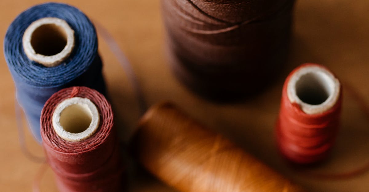 Brown Threads on Brown Wooden Table · Free Stock Photo