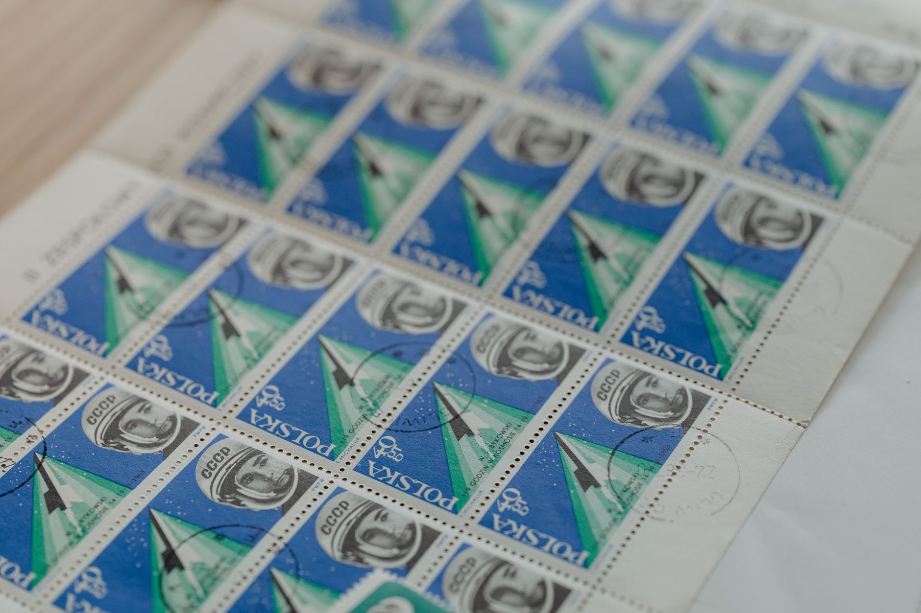 Close-up of collectible Polish postage stamps depicting space exploration themes.