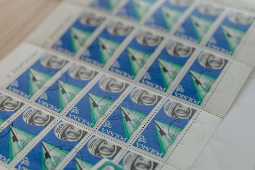 Close-up of collectible Polish postage stamps depicting space exploration themes.
