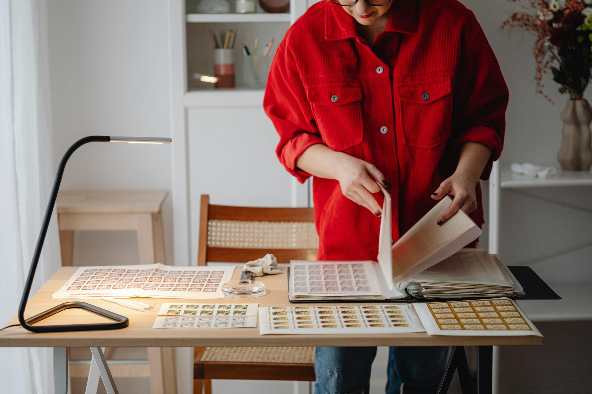 Woman with Collection of Stamps