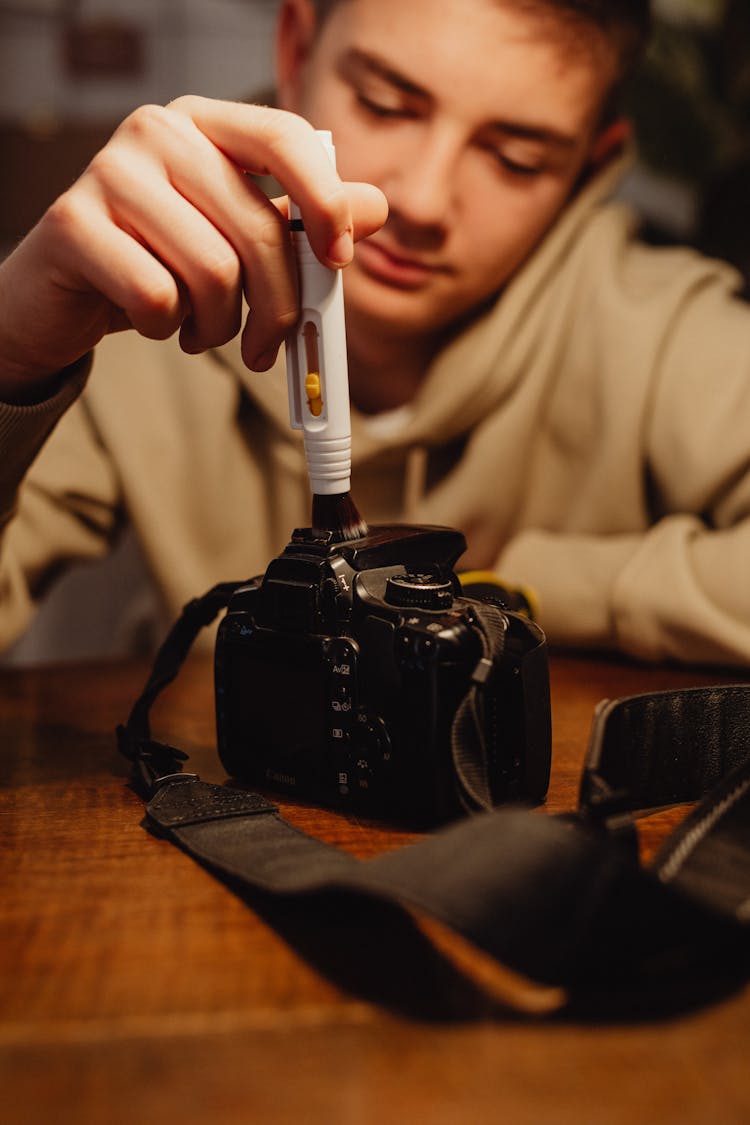 Guy Cleaning Professional Camera