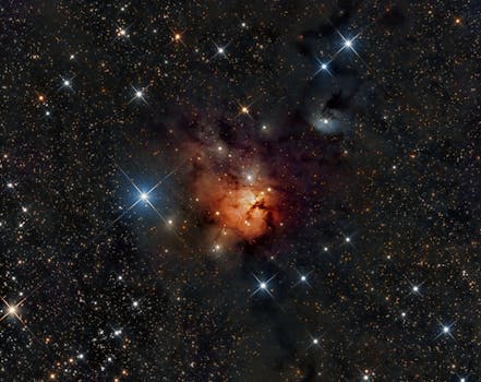 A magnificent view of a dense star cluster with a vibrant nebula at its heart, illuminating the cosmos.