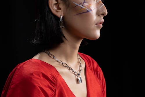 Free Woman with Face Paint Wearing a Silver Chain Necklace Stock Photo