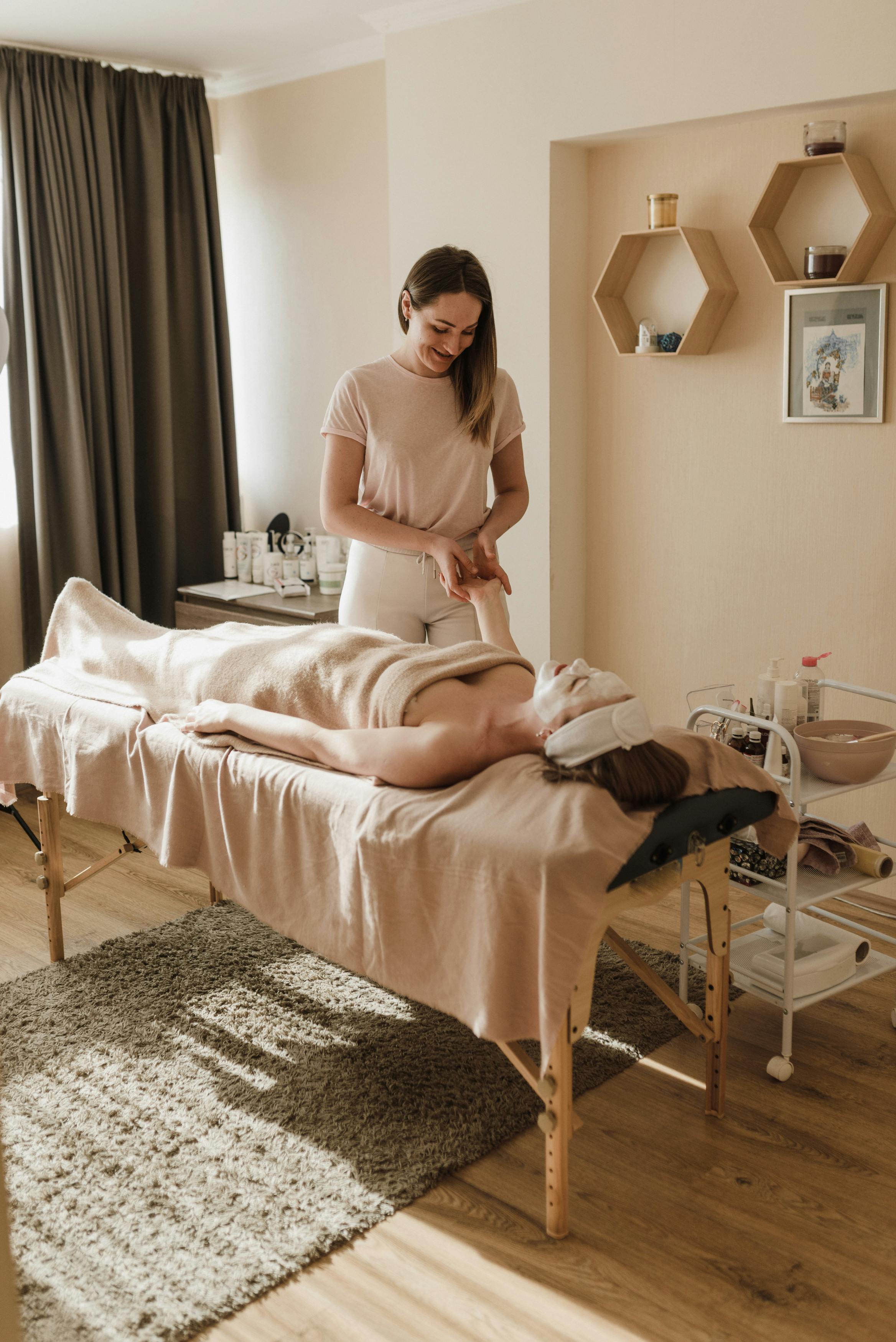 woman having body massage and facial treatment