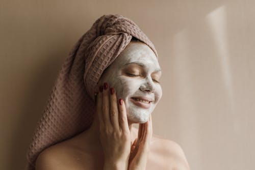 Free A Woman With a White Facial Mask Stock Photo