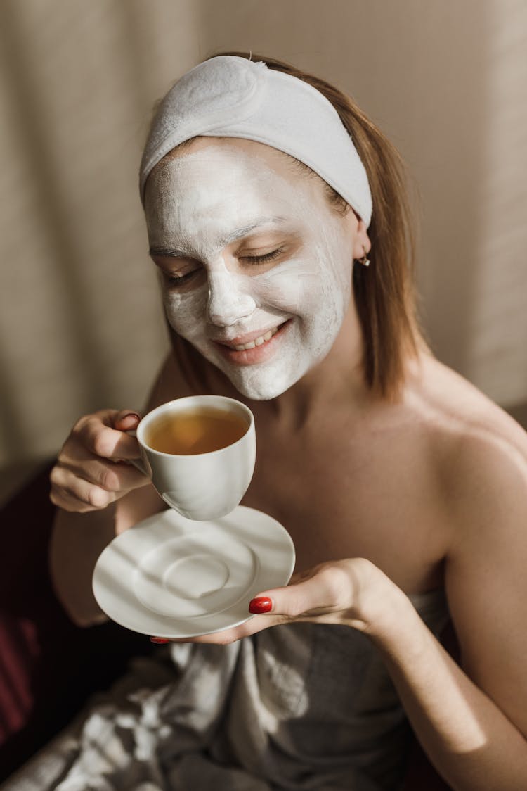 A Woman Holding A Teacup