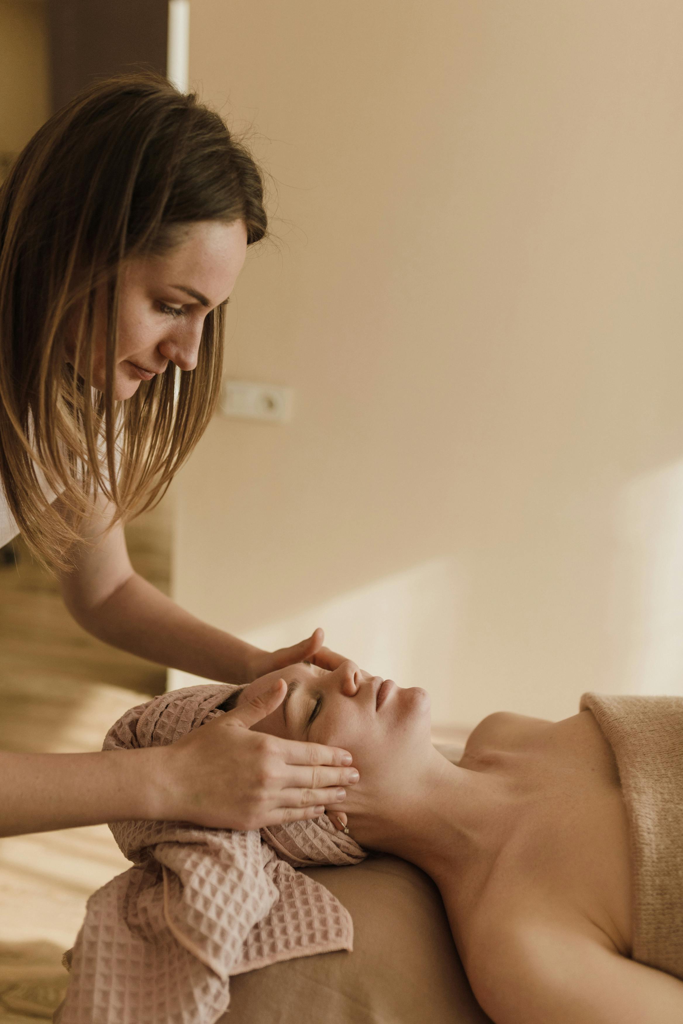 a woman having a facial massage