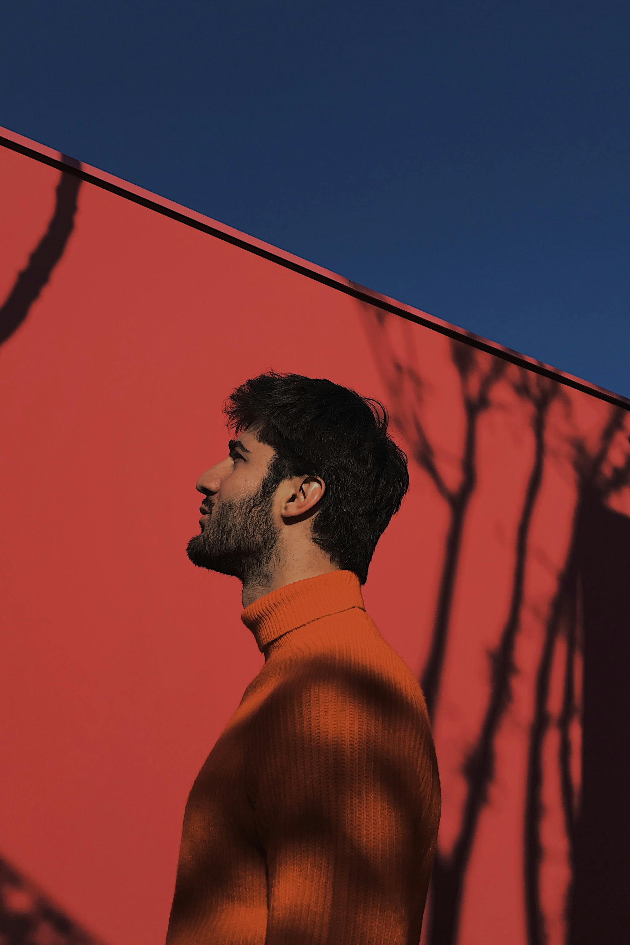 A person's hands holding a smartphone displaying a mobile game.