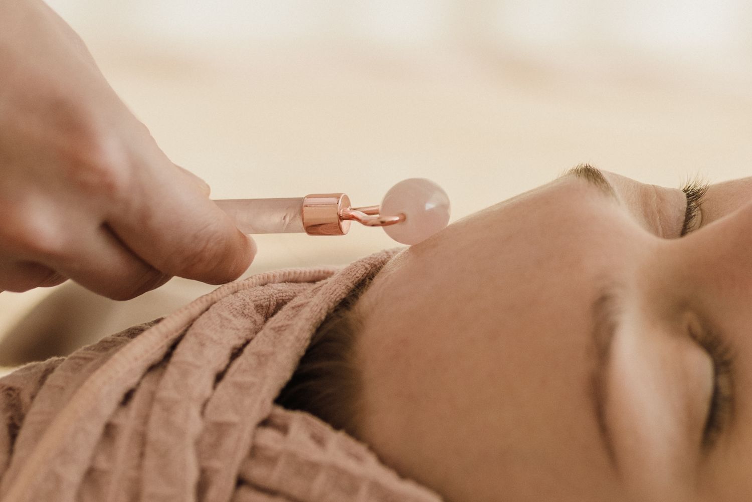 Facial roller treatment in a calm professional beauty setting