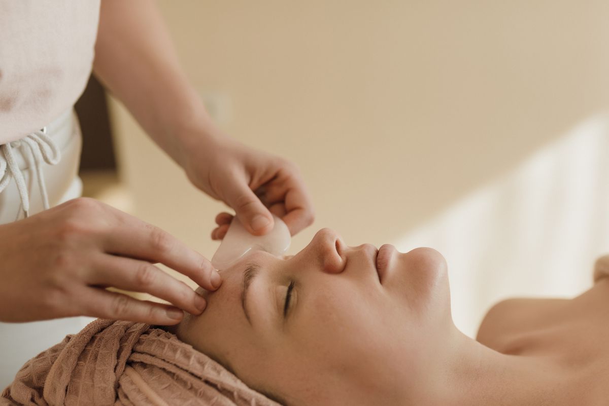 A calm spa facial treatment in a warm, quiet room