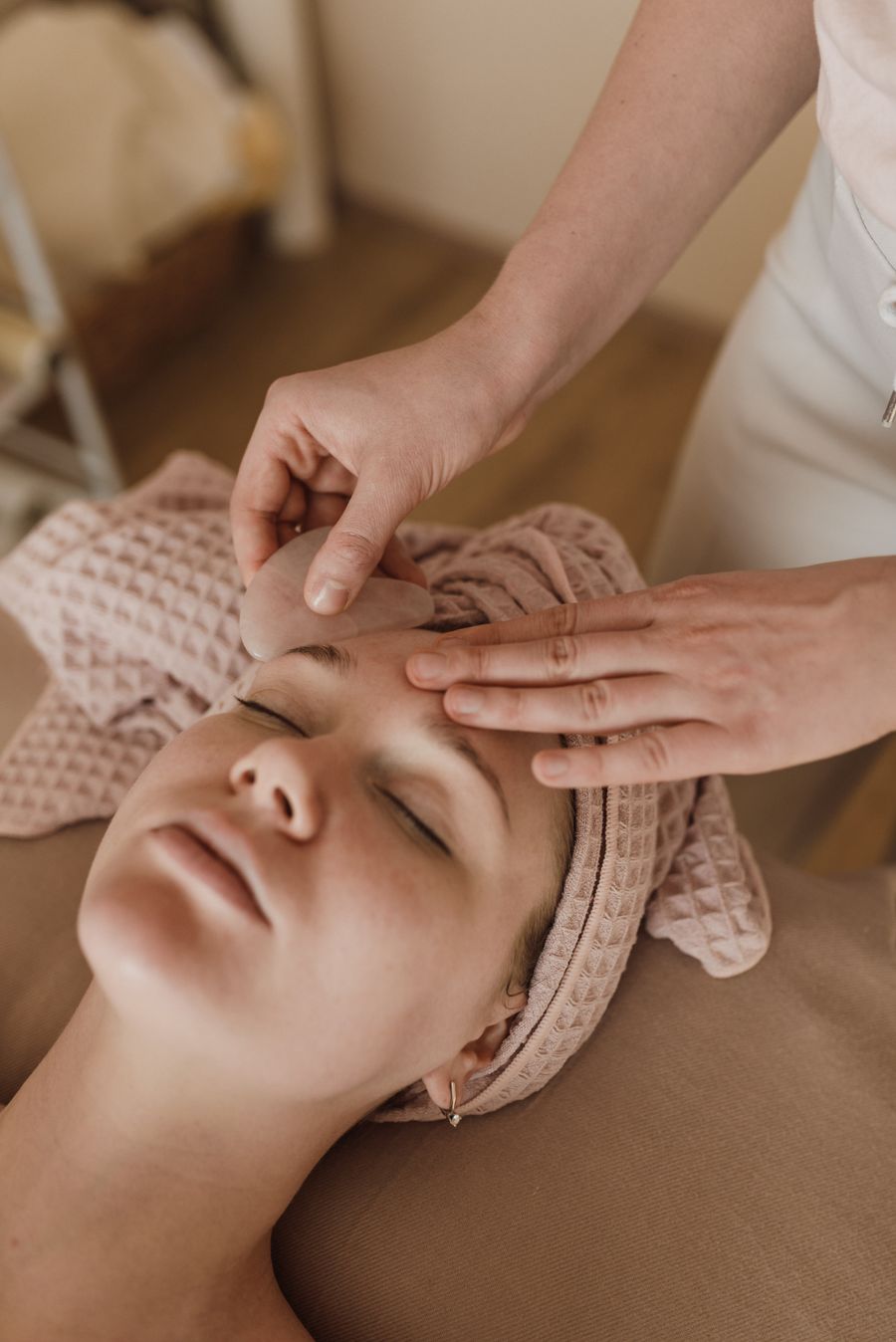 Client receiving a facial treatment at an esthetics studio