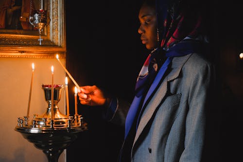 A Woman Holding a Lighted Candle