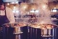 Steaming pots on a kitchen range, photo by Timur Saglambilek on Pexels