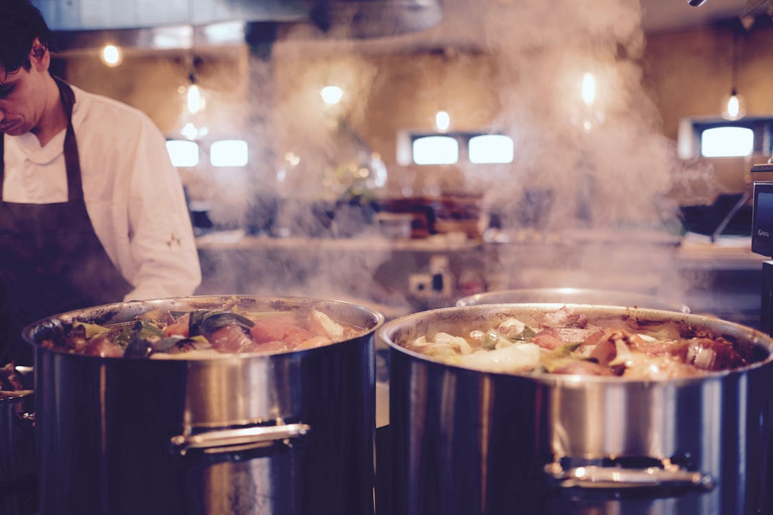 Free Man Wearing Black Apron Near Two Silver Metal Cooking Pot Stock Photo