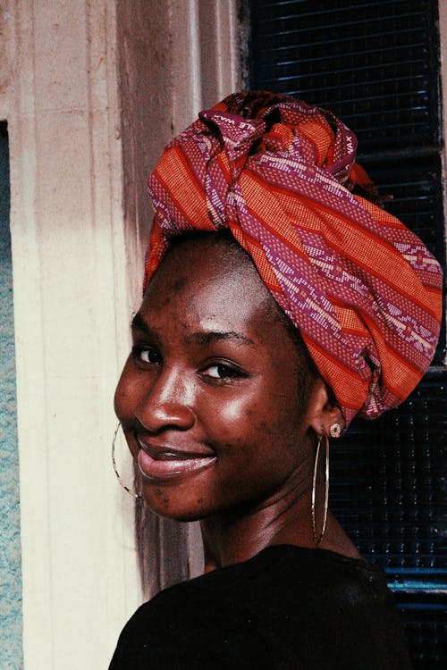Happy black woman with turban on head
