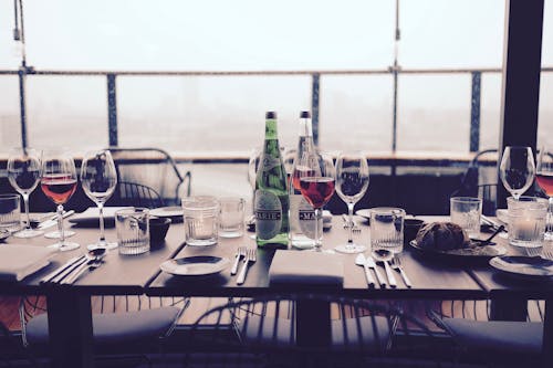 Wine Glass on Top of Table Near Silverware