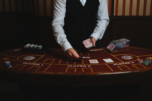Free Man Displaying Cards in Casino Stock Photo