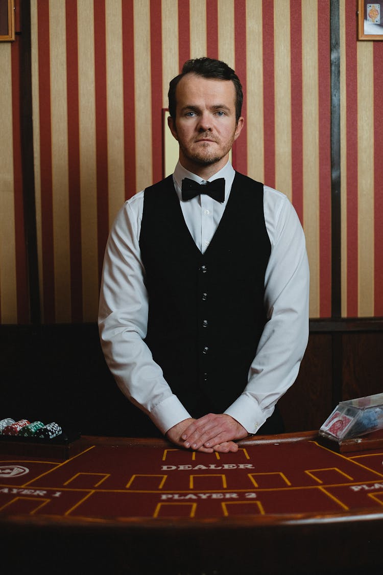 Portrait Of Croupier At Casino Table