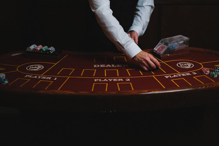 Close Up Of Blackjack Table And Croupier Hands