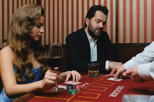 Man and Woman Gambling in Casino