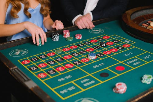 Free A Person Holding Casino Chips Stock Photo