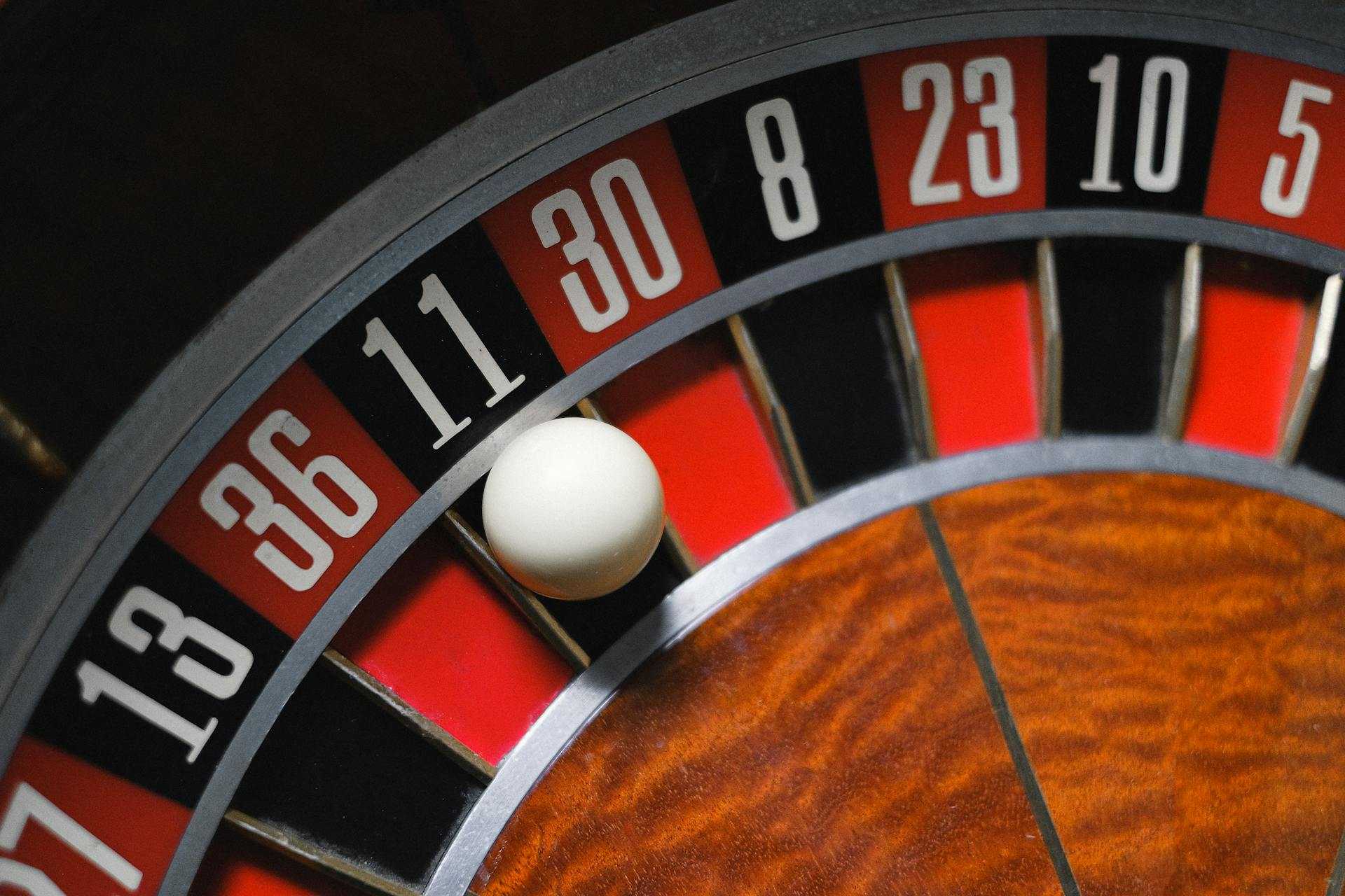 Close-up of a Ball Landing on Number 11 Black in Roulette