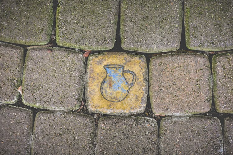 Close-up Of Painting On City Pavement 