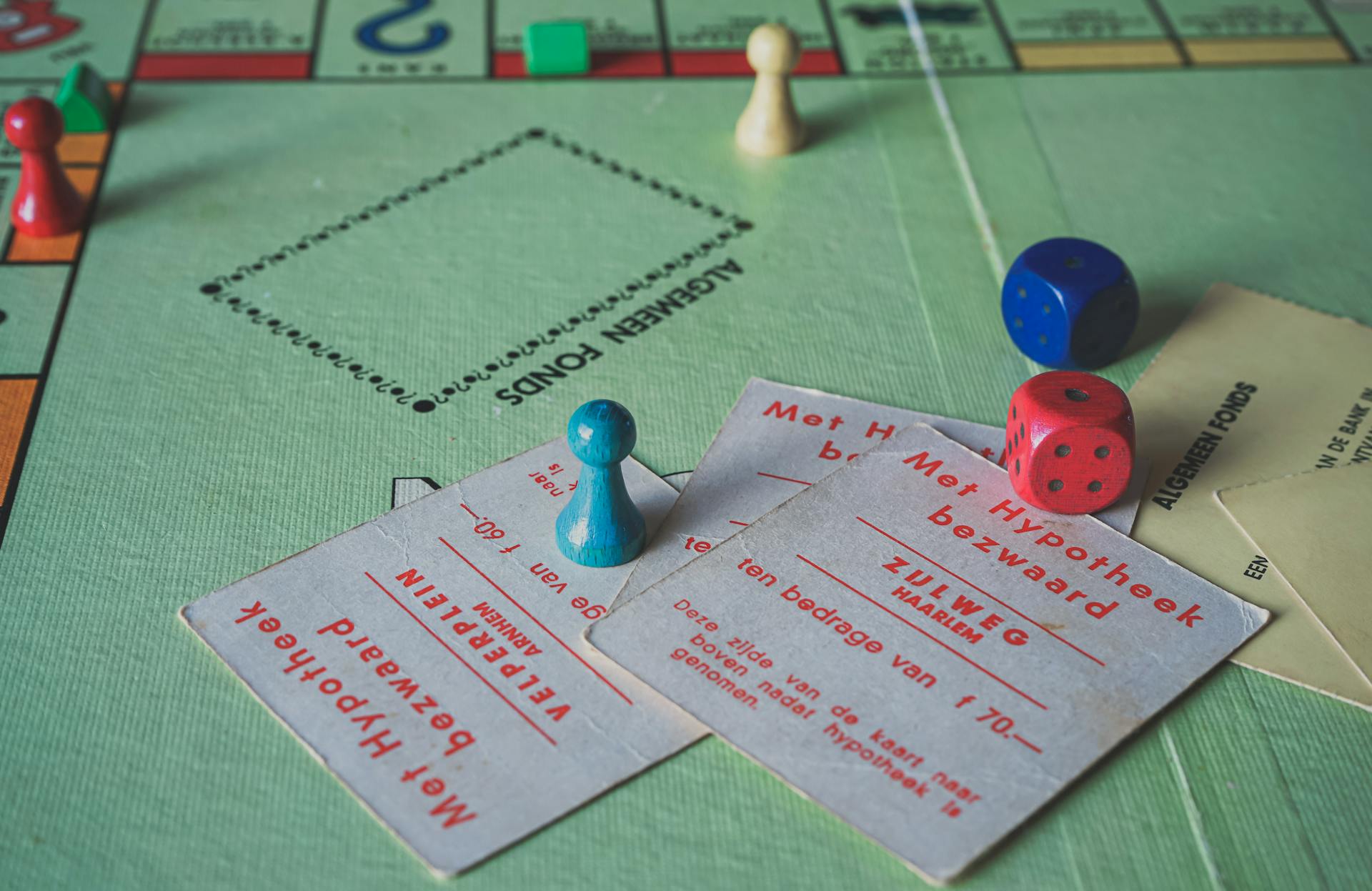 Close Up Photo of Monopoly Game Items