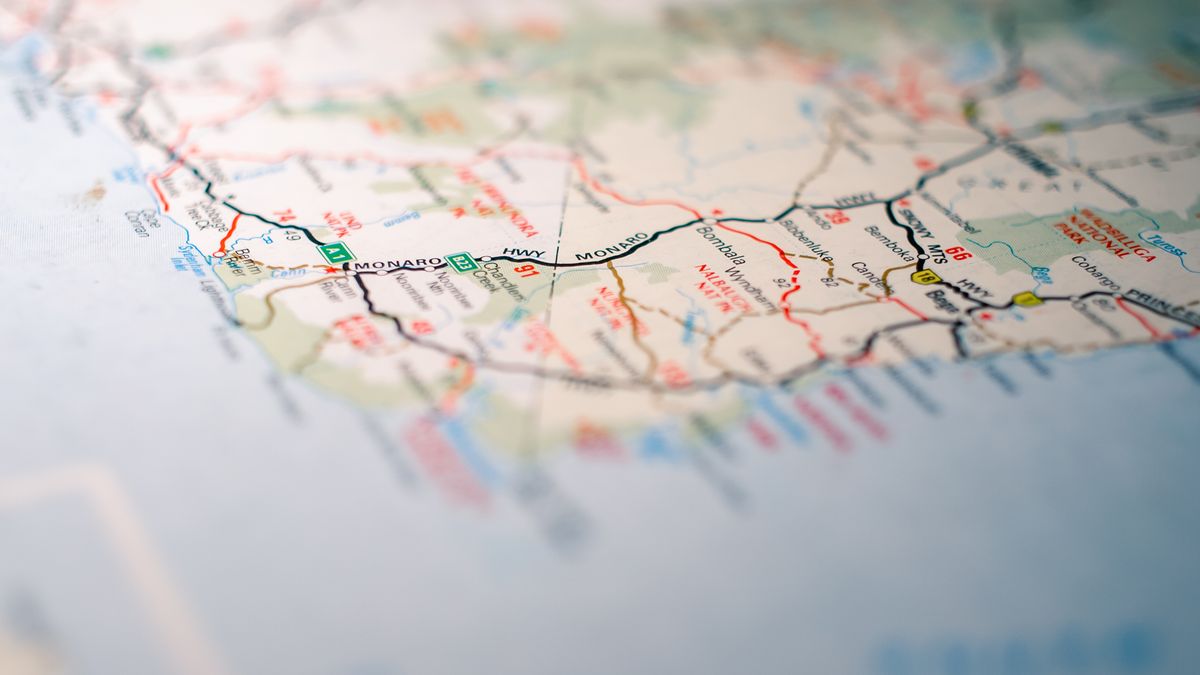 Focus on intricate details of a geographic map, highlighting travel routes.