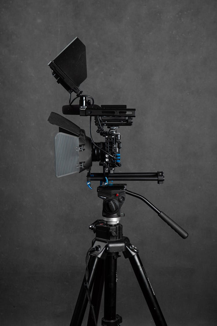 Video Camera On Tripod In Studio