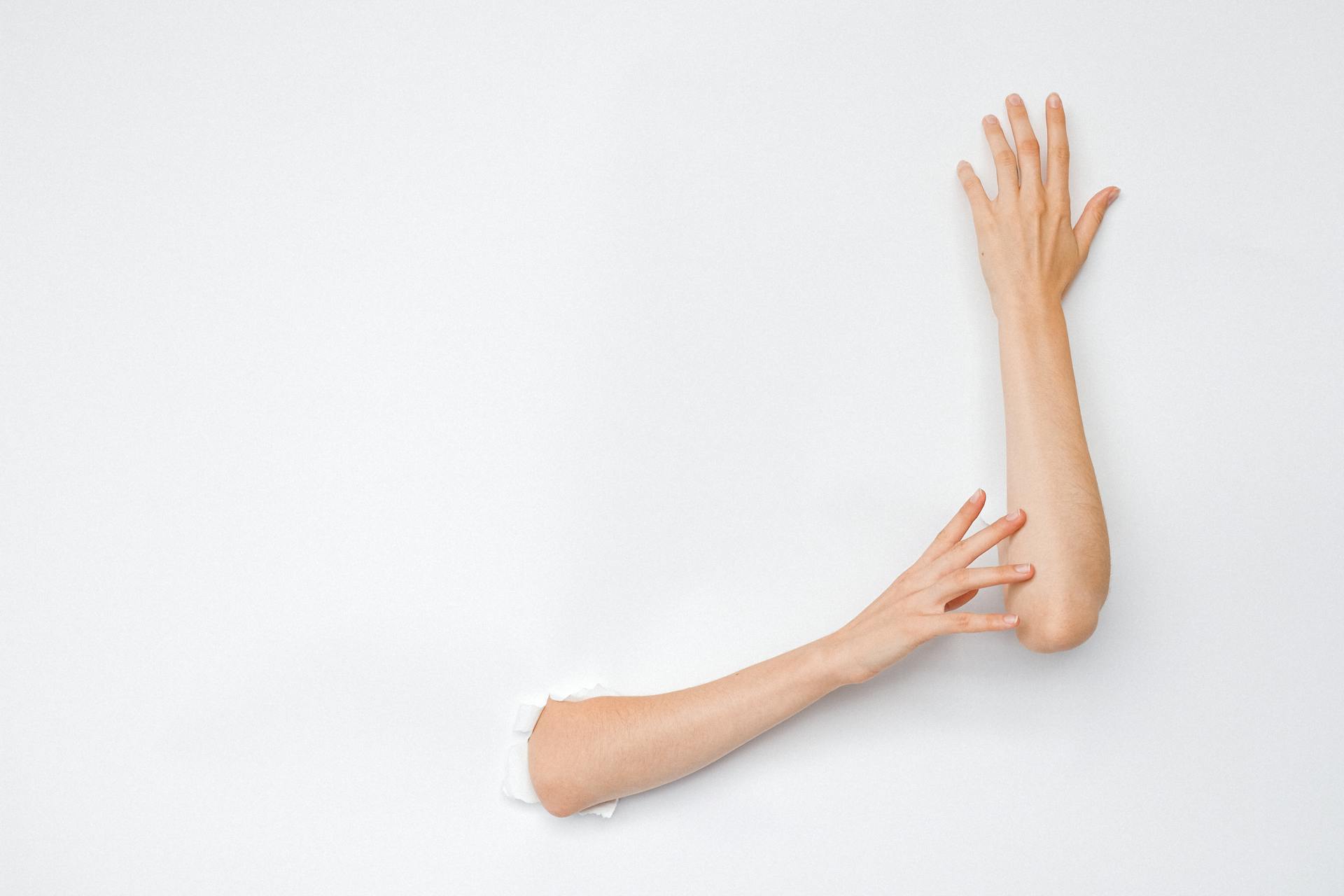 A Person's Hands through a Hole