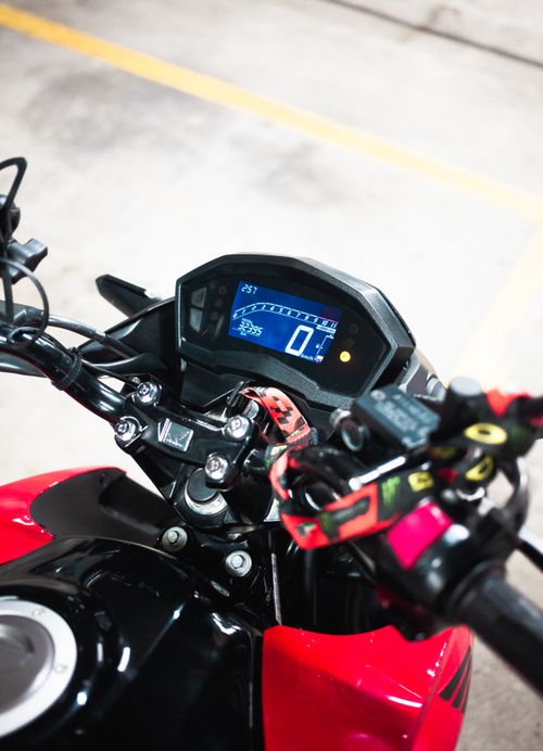 Free Detailed view of a motorcycle dashboard displaying speedometer and controls. Stock Photo