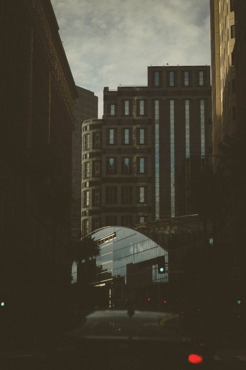 Free A moody evening scene of urban architecture in a city downtown. Stock Photo