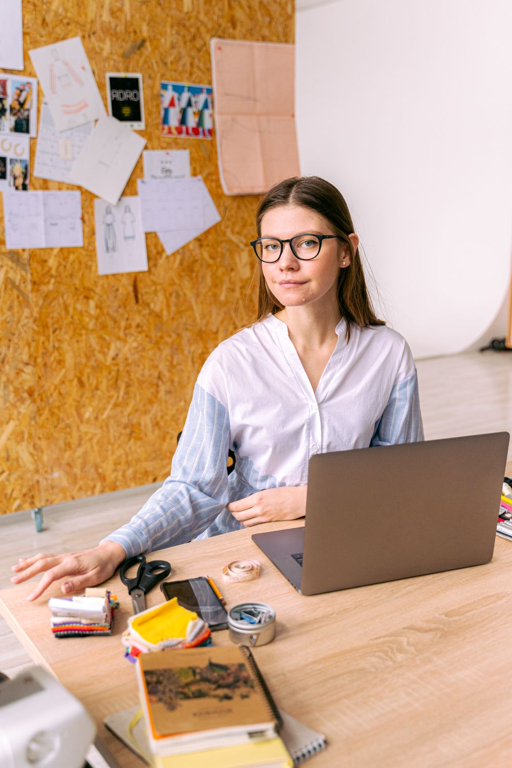 Wren Calloway, content creator coach, at her desk