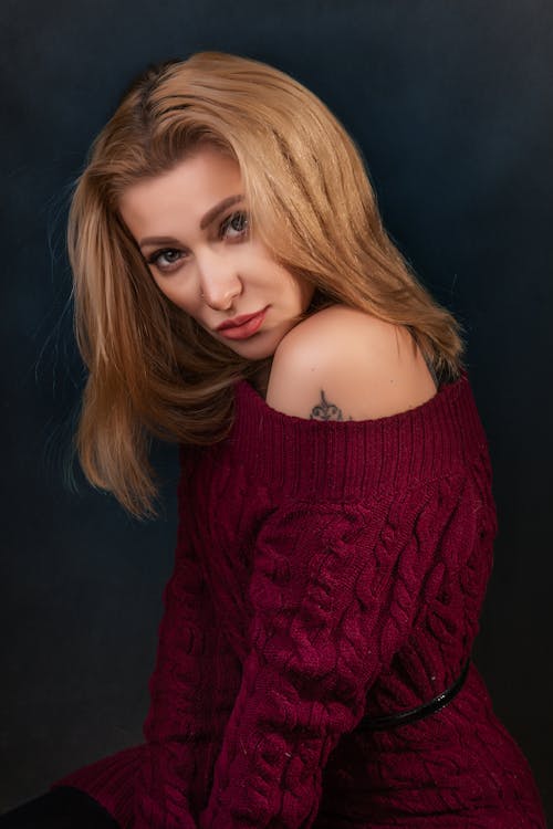 Close-Up Shot of a Woman in Knitted Maroon Sweater
