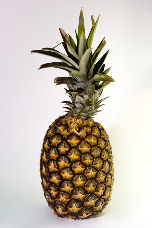 Photograph of a Pineapple on a White Surface