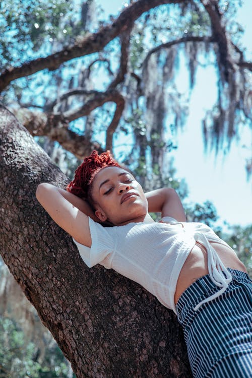 Woman in White Crop Top Hands Behind Her Head