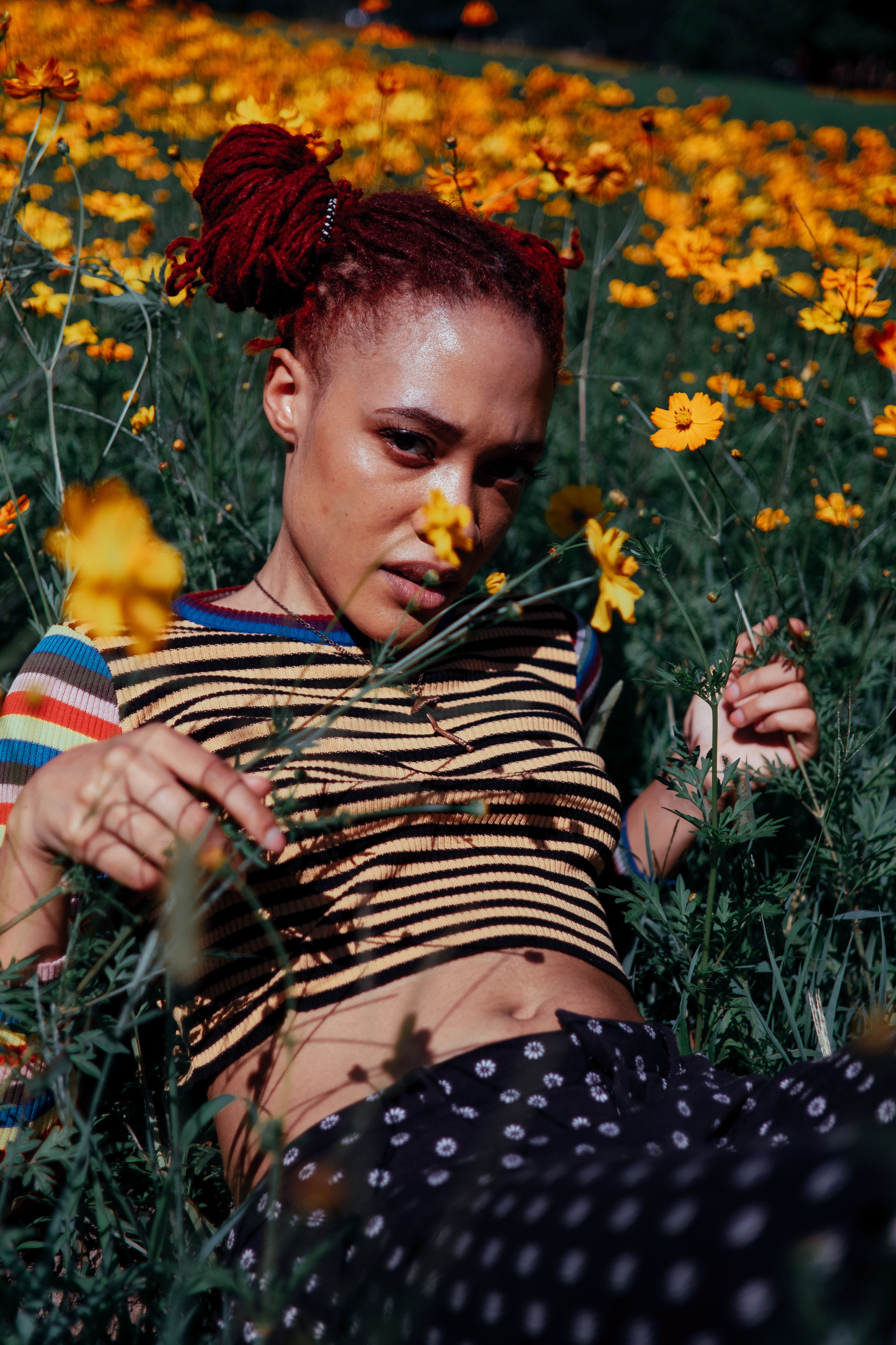 Photograph of a Woman with Red Hair Lying on the Grass with Flowers ...
