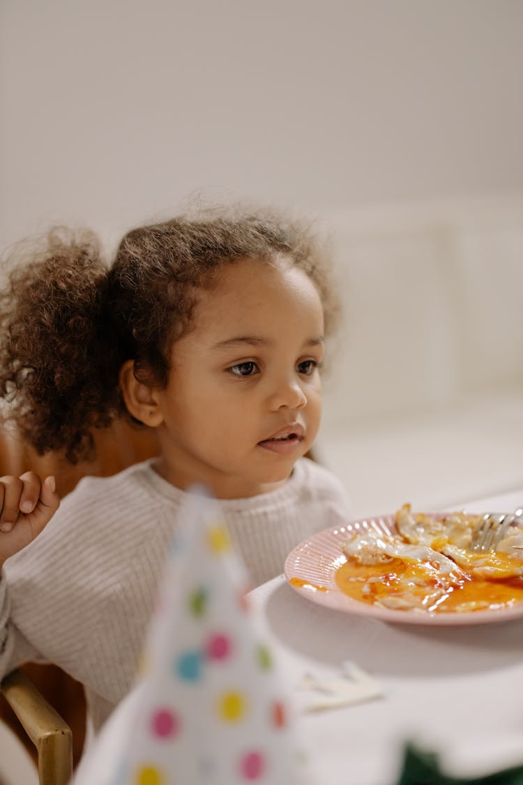 Girl In White Long Sleeve Shirt Eating Eggs 