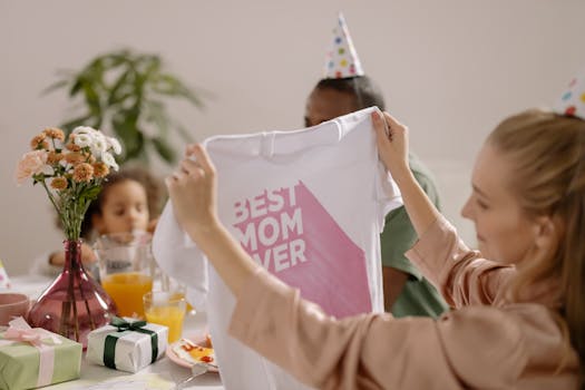 A joyful indoor Mother's Day celebration featuring a family with a 'Best Mom Ever' shirt.