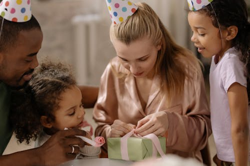 Mother Opening Present from Her Family