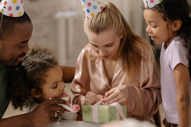 Mother Opening Present From Her Family