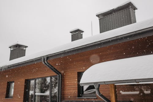 Snow-Covered Roof with Chimneys