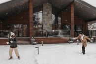 Brown and White Concrete Building Covered With Snow