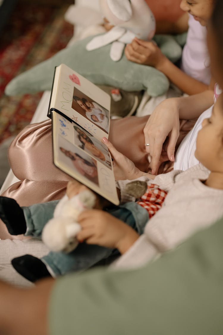 Children Looking A Photo Album