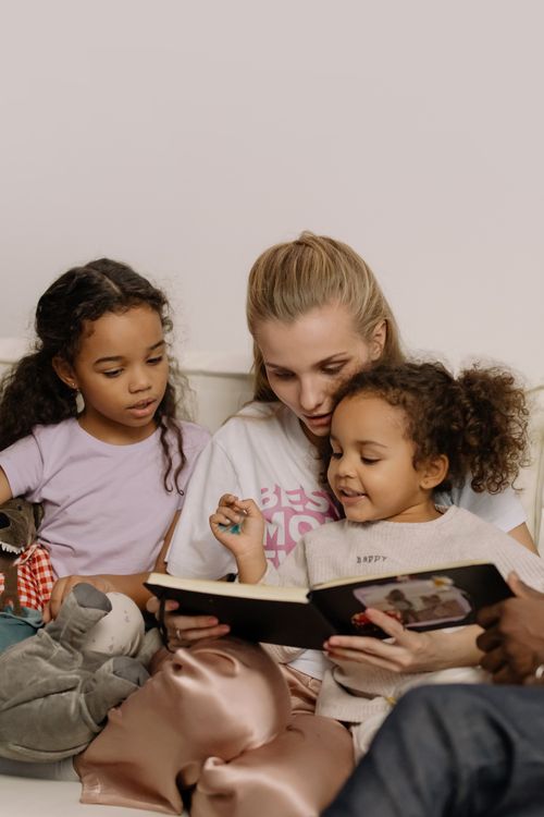 A family reading a storybook together at home