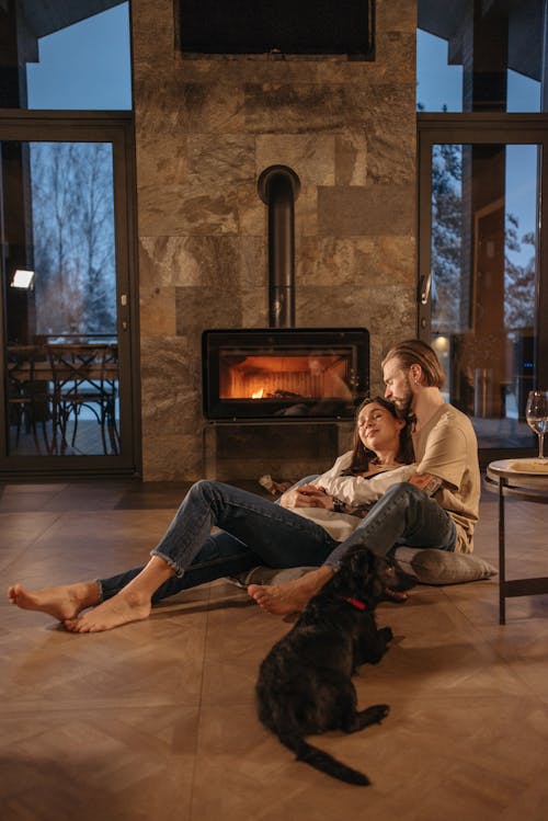 Man and Woman Resting on the Fireplace