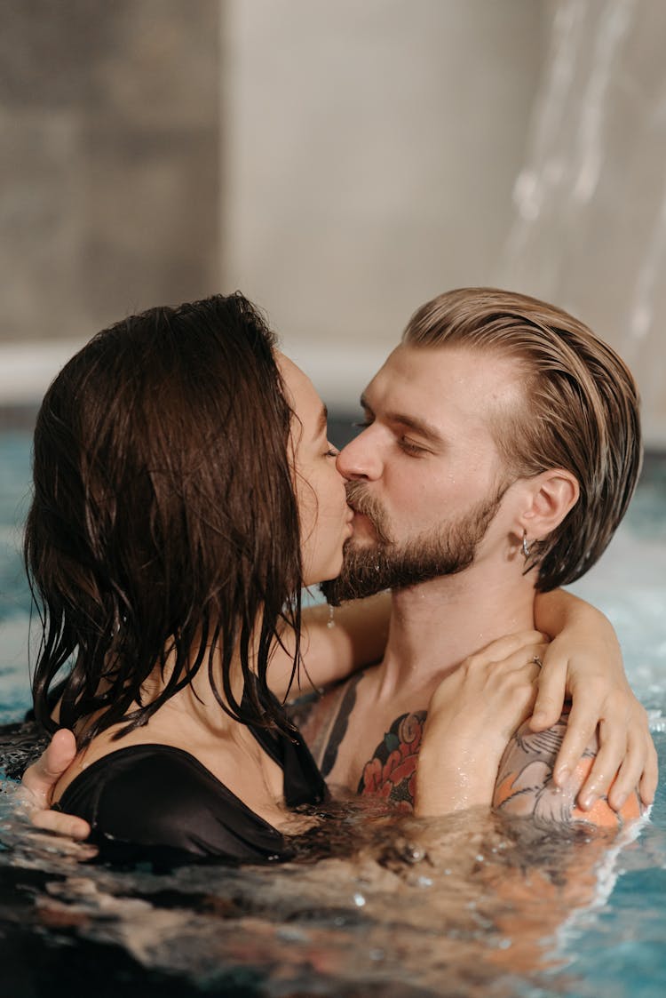 A Couple Kissing In The Pool