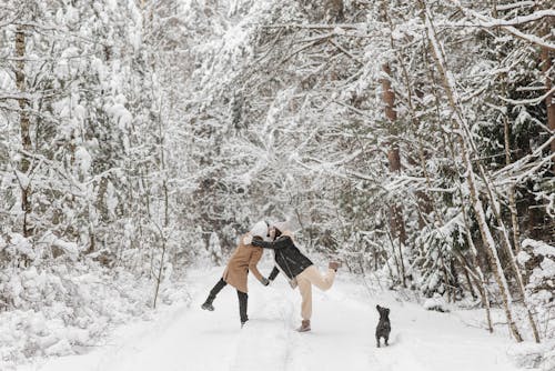 A Couple a Snow Covered Pathway